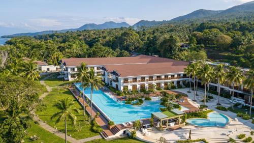 Mahinog Resort | Relax at Nouveau Resort: Oceanfront Bliss with Pool Access