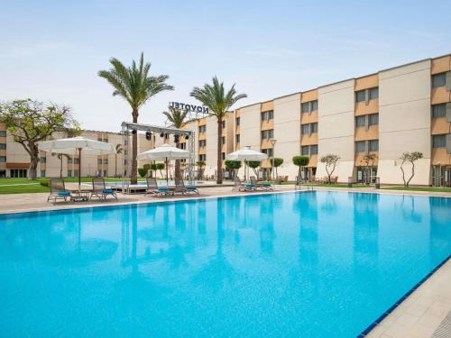 An-Nuzhah Hotel | Discover Novotel Cairo Airport with Pool and Spa Amenities
