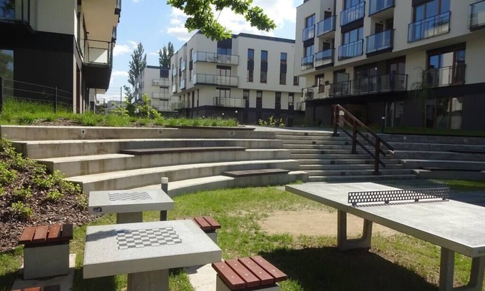 Krzyki Apartment | Modern Riverside Apartment in Wrocław with Parking & Amenities