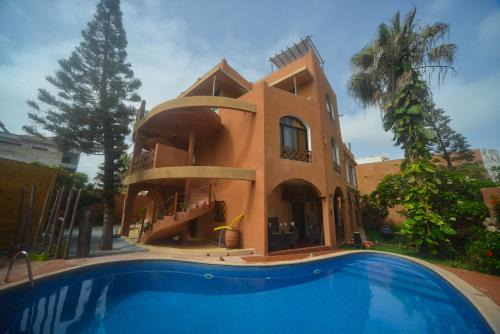 Yof Bed & Breakfast | Nyéléni Maison Sahel: Beachfront Bliss with Pool Access