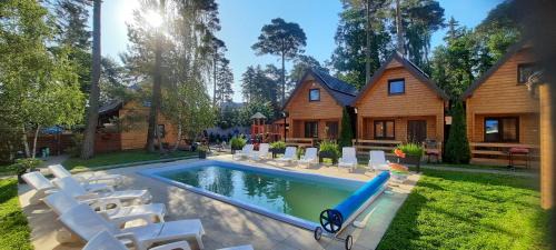 Pobierowo Resort | Experience Ośrodek 9Amber: Family-Friendly with Pool & Pets