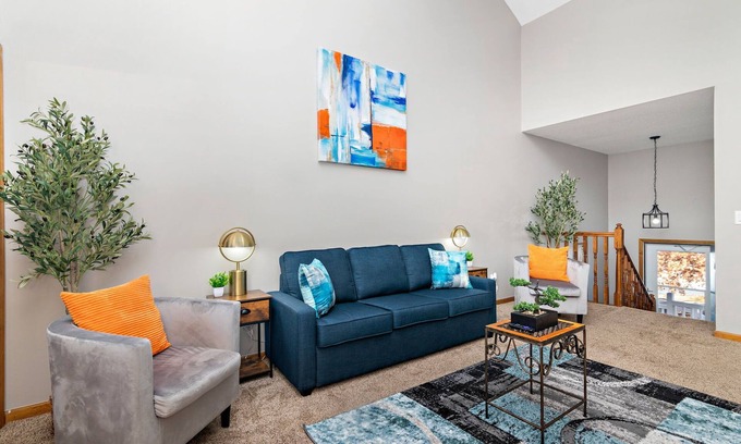 Raymore House | Spacious Oak Haven: 3 King Beds, Hot Tub & Free Parking