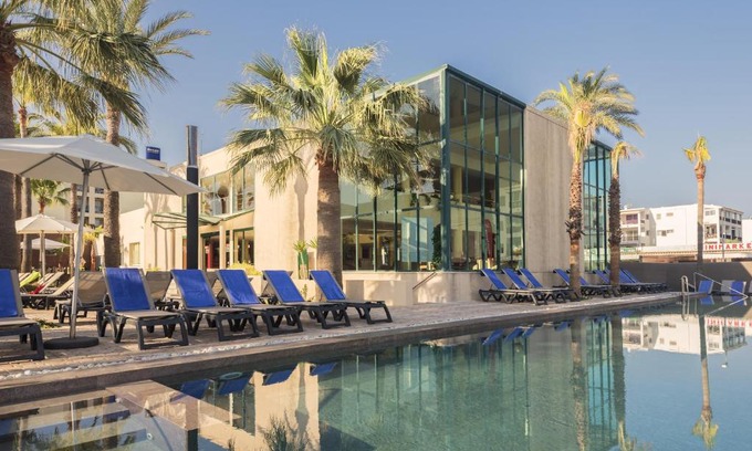San Antonio Bay Hotel | Relax at Occidental Ibiza: Oceanfront Retreat with Pool