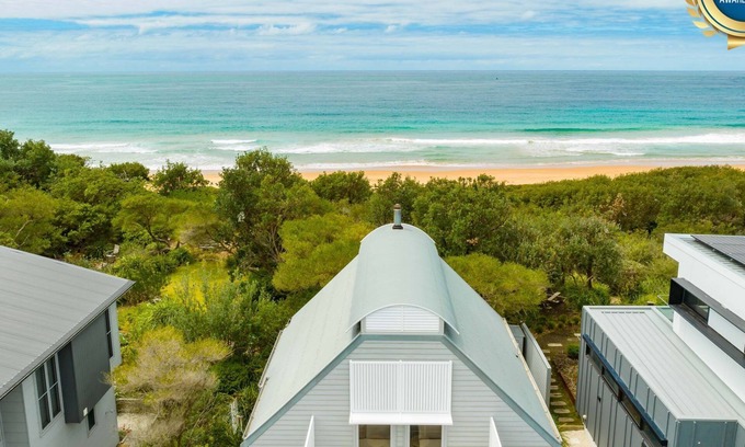 Culburra Beach House | Ocean Dunes: Beachfront Escape with Cozy Fireplace