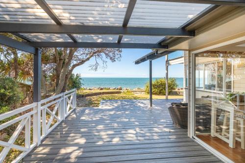 Beachmere House | Ocean Pearl: Beachfront 3-Bedroom Retreat with Pool