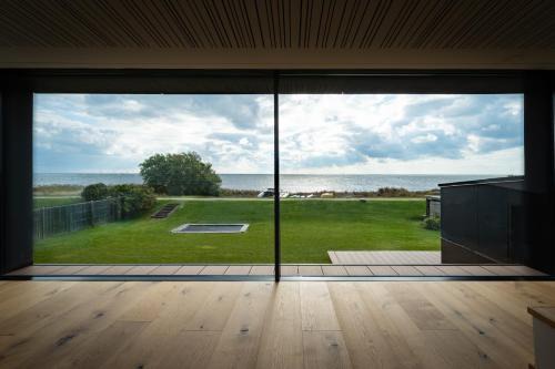 Dragor Apartment | Oceanfront Retreat: Architectural Gem with Spa & Ocean View