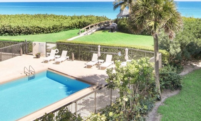 Juno Beach Condo | Oceanfront Condo on the beach 2bed 2ba renovated ocean views heated pool hot tub