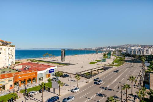 Malabata Apartment | Beachfront Apartment with Balcony, Pool & Ocean Views