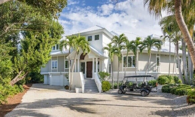Wulfert House | Beach Access with Pool, Spa & Free Boat Ride Included