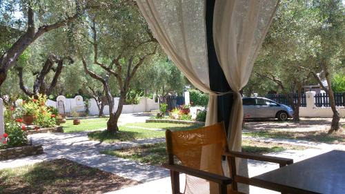 Elia Nikitis Apartment | Olive House: Rated 9/10 with Cozy Fireplace & Hot Tub