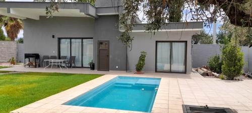 Maipu House | Ideal Oceanfront Retreat at Olivos Luján - 4 Star Stay