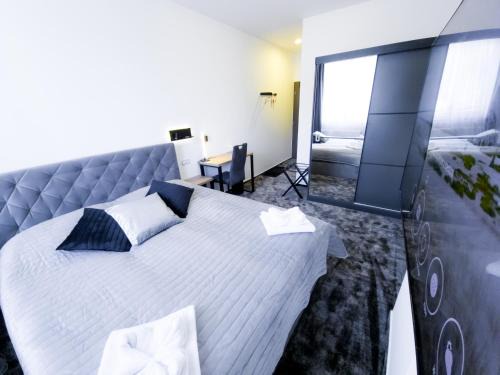 Trutnov Hotel | Discover Olympland Hotel: Family-Friendly with Pool & Hot Tub