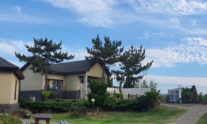 Seongsan House | Relax at On The Stone Pension: Oceanfront Pet-Friendly Retreat