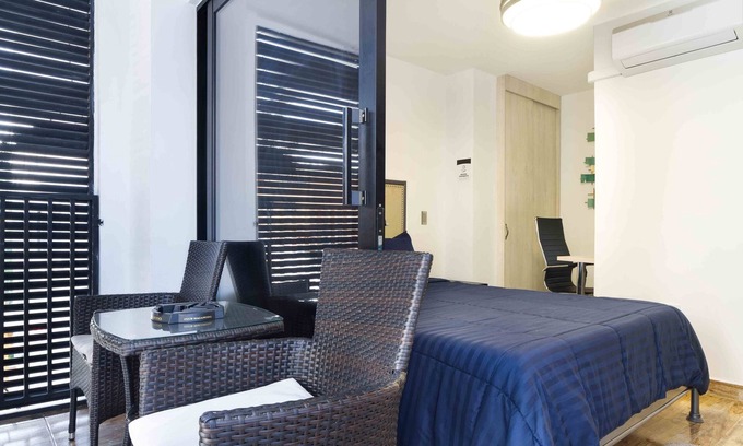 Medellin Apartment | Perfect Retreat: One Bedroom with Balcony & Hot Tub