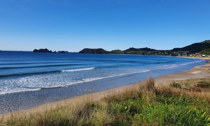 Opito Bay House | Opito Bay Charmer - Sun drenched family bach is a real charmer.