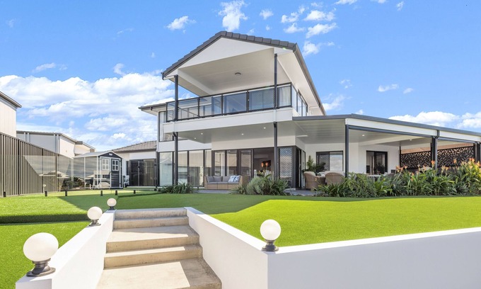 Banksia Beach House | Elegant Canal-Front Escape with Private Heated Pool