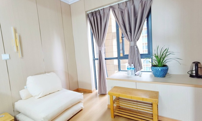 Gaoxin Hotel | Cozy Orange Mingwu Hotel Featuring a Cat Cafe Experience