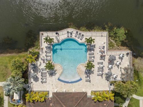 Ocoee Apartment | Orlando Oasis: Modern 4BD with Pool and Lake View