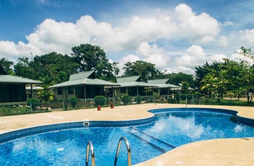 La Simplicite Hotel | Overbridge River Resort: Relax by the Private Beach & Pool