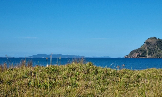 Kennedy Bay House | Beachfront Bliss at Pūkeko Retreat with Family Amenities