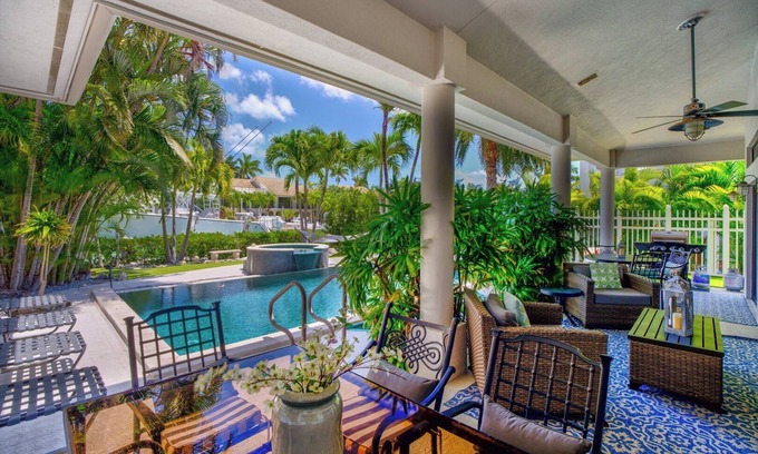 Coury House | Idyllic 4-Bedroom Home with Pool and Dock in Key Colony