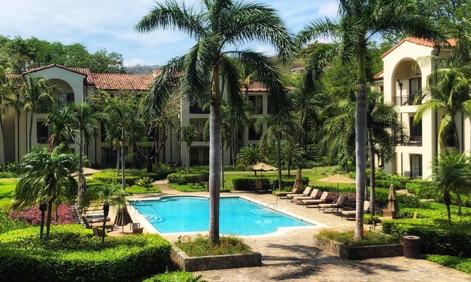 Coco Condo | PACIFICO L1007 - Tropical Pool Views - Beach Club Access - Walk to Beach