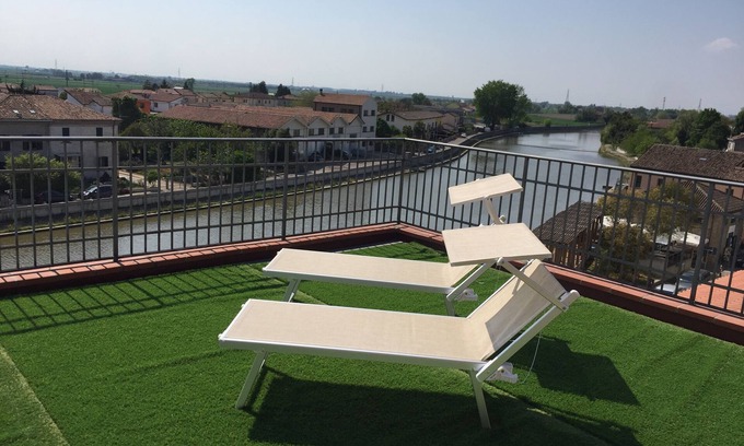 Codigoro Apartment | Palazzo Spada: Penthouse with River View & Top Amenities