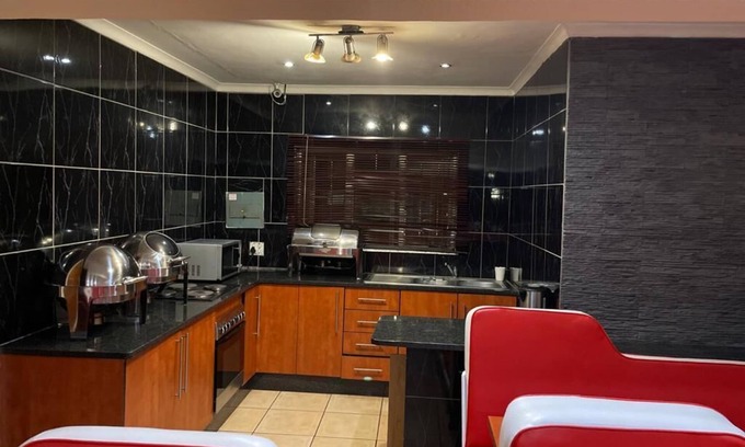 Rustenburg Bed & Breakfast | Cozy Pale Bohemia Bed and Breakfast with Family-Friendly Amenities
