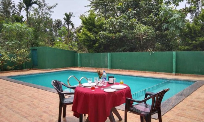 Kushalnagar Resort | Relax at Palm Era Resorts with Pool and Family-Friendly Perks