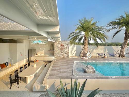 Pak Nam Pran House | Oceanfront Palm Springs Villa Pranburi with Pool & Views
