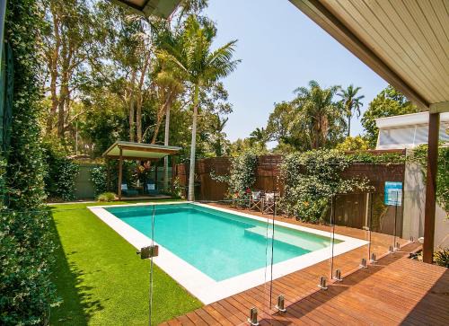 Coolum Beach House | Beachfront Pandanus Holiday Home with Pool & Pet-Friendly Perks