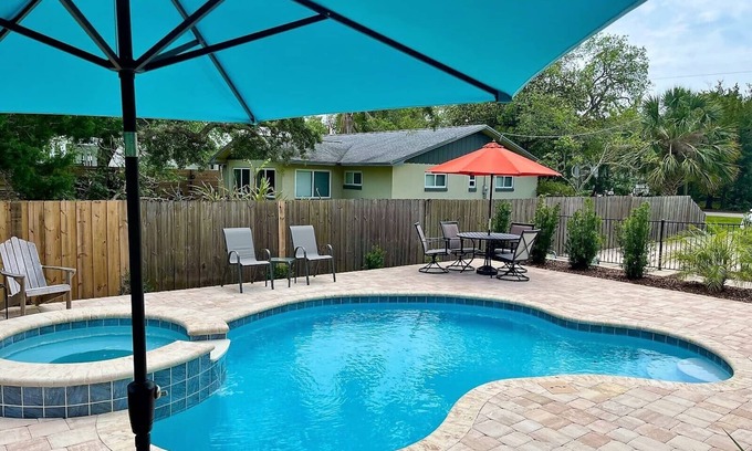 Butler Beach House | Paradise by the River: Pet-Friendly Retreat with Pool & Spa