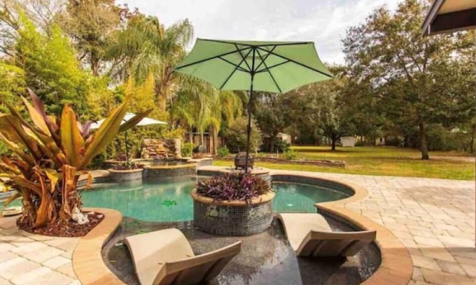 Terrace Park House | Exquisite Paradise in Tampa: Pool & Waterfall Oasis