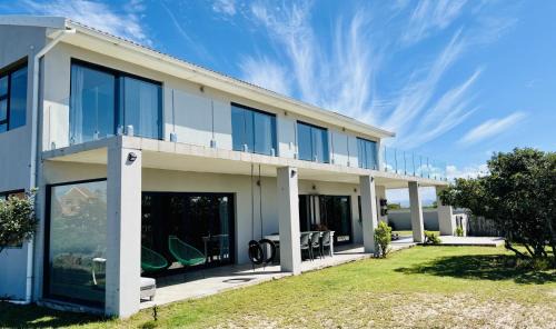 Paradise Beach House | Oceanfront Paradise: Pet-Friendly Beach Retreat with Top Ratings