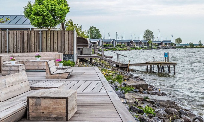 Bovenkarspel House | Relax at Pavilion 5 by Interhome with Spa and Lake Views