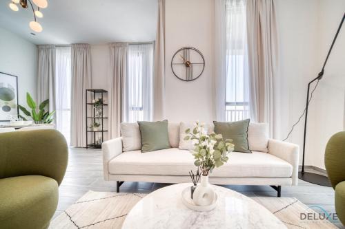 Dubai Production City Apartment | Tranquil 2BR Retreat with Pool & Breakfast in Dubai