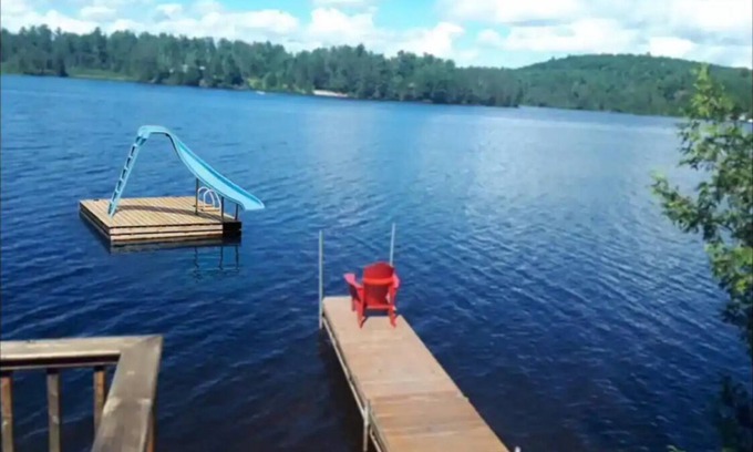 Joly Cottage | Tranquil Lakefront Cottage: Pet Friendly & Pool Access