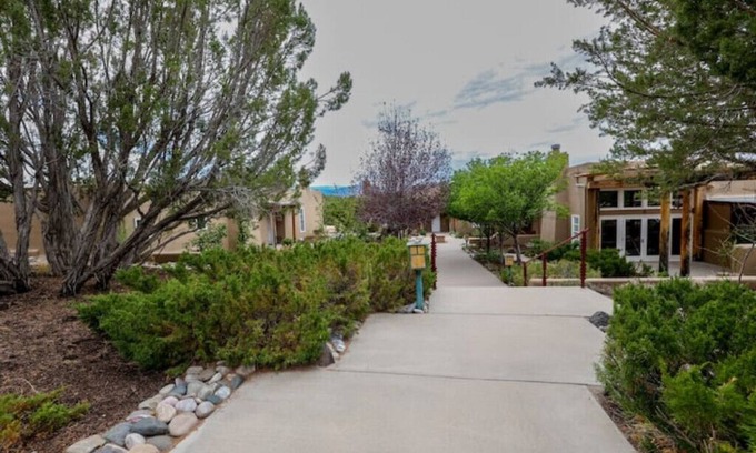 Ojo Caliente Apartment | Serene Black Mesa King Room - Pet Friendly & Family Ready