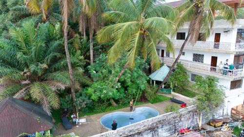 Conakry Bed & Breakfast | Pet-Friendly Retreat at Pension Les Palmiers with Pool Access