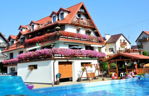 Mikolajki Resort | Relaxing Oceanfront Retreat with Pool and Hot Tub