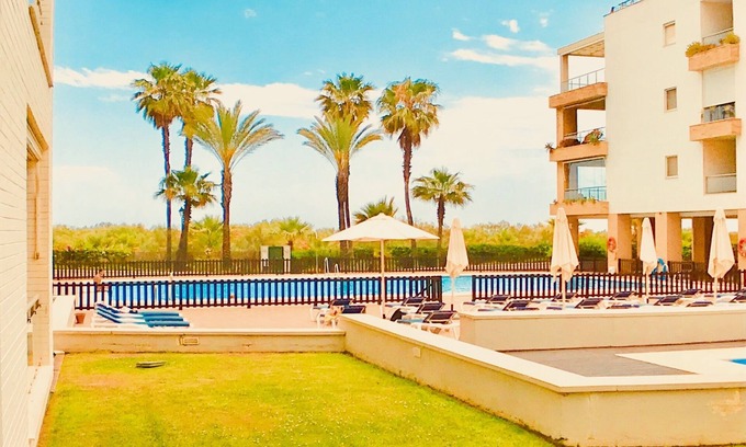 Punta del Moral Apartment | Inviting Penthouse in Isla Canela with Pool & Sea Views