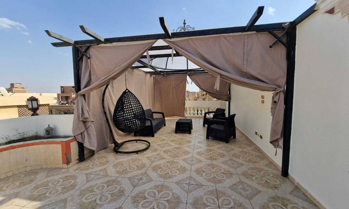 Pyramids Gardens Apartment | Inviting Penthouse with Spa Near the Pyramids