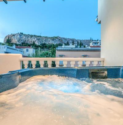 Filopappou Apartment | Elegant Penthouse Studio with Hot Tub in Athens
