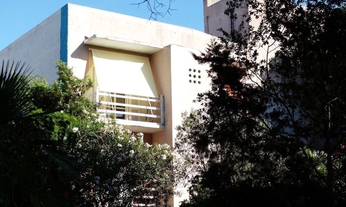 Santa Teresa di Gallura Apartment | Cozy Flat with Balcony Overlooking the Garden & Ocean View