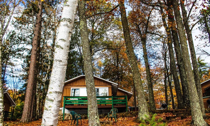 St Germain Cottage | Experience Pine Haven Resort Unit #5 with Lake Views & Pool