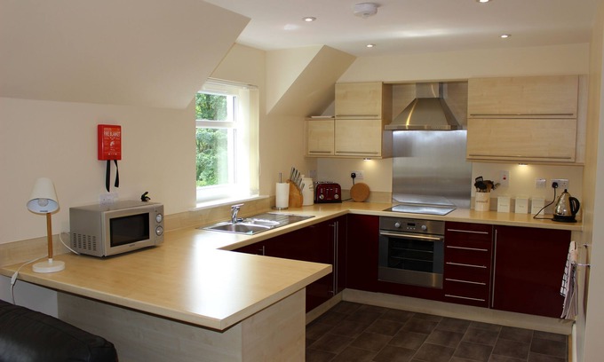 Invergarry Apartment | Idyllic Pine View: Riverfront Retreat with Family-Friendly Amenities