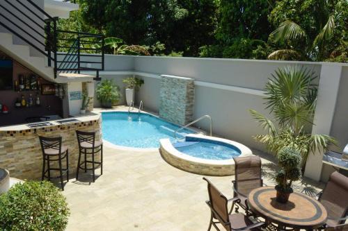 Arouca Apartment | Discover Pineridge Hideaway: 9.7 Rated Poolside Escape