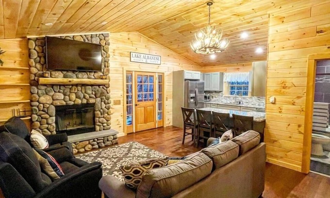 West Oneonta Cabin | Lakefront Log Cabin Retreat with Kayaks and Hot Tub