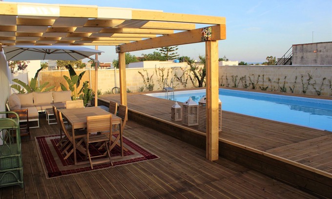 Torre Lapillo Villa | Pink Cottage: Cozy Studio with Pool & Garden Oasis
