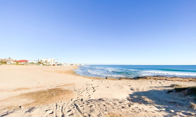 La Siesta Apartment | Inviting Pink Summer Apartment with Oceanfront Amenities